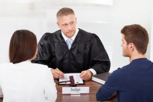 In litigation a judge makes divorce settlement decisions